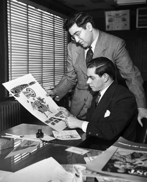 Jerry Siegel and Joe Shuster, seated, in their studio, ca. 1942. (Personal collection of Brad Ricca.)