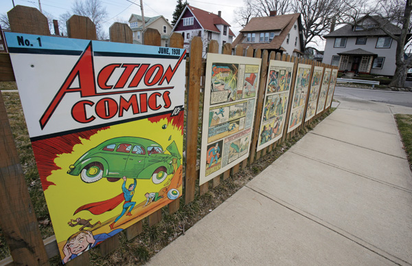 Superman comic book pages outside Joe Shuster's boyhood home in Cleveland celebrate the seventy-fifth anniversary of the Man of Steel. (© Tony Dejak/ /AP/Corbis.)