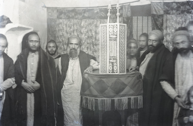 “Interior of the Al-Kissar Synagogue,” showcasing its ornate Torah case. 