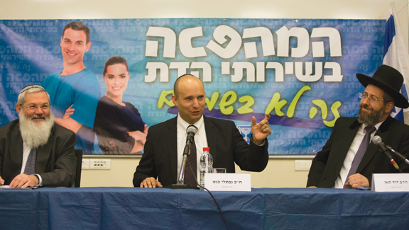 From left: Rabbi Eli Ben-Dahan, Israel's Deputy Minister of Religious Affairs; Naftali Bennett, Minister of Religious Services; and Chief Rabbi David Lau at a press conference, February 2014. The banner behind them reads “The Revolution in Religious Services.” (Photo by Yonatan Sindel/Flash90.)