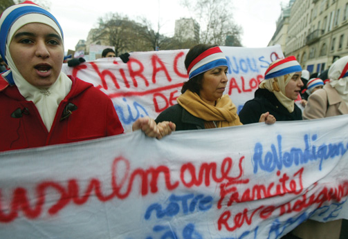 Muslim women demonstrate against the French proposal to ban the hijab, or headscarf, in state schools.