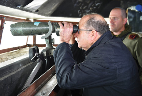 Israeli Defense Minister Moshe Ya’alon visits a military outpost on Mount Hermon.