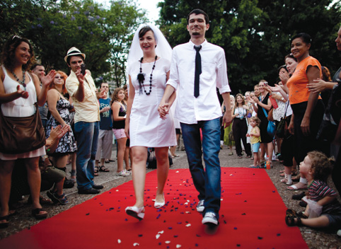 Yulia Tagil and Stas Granin celebrate their alternative wedding ceremony in a Tel Aviv square, July 2010, to protest the guidelines set by the Chief Rabbinate. (Photo by Uriel Sinai/Getty Images.)
