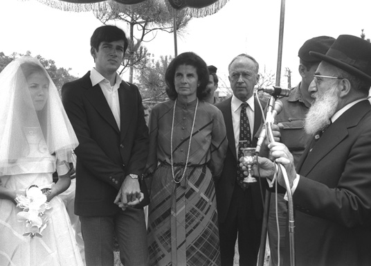 Chief Rabbi Shlomo Goren conducts the wedding ceremony of Yuval Rabin and his wife, Elat, Kfar Shmaryahu, May 18, 1976. (Photo by Yaacov Saar, courtesy of the Government Press Office, Israel.)