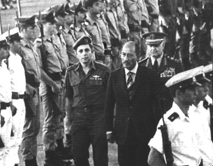 Menahem Milson with President Sadat as he reviews the Honor Guard at Ben-Gurion Airport before his return to Egypt, November 21, 1977.  (Photo courtesy of the author.)