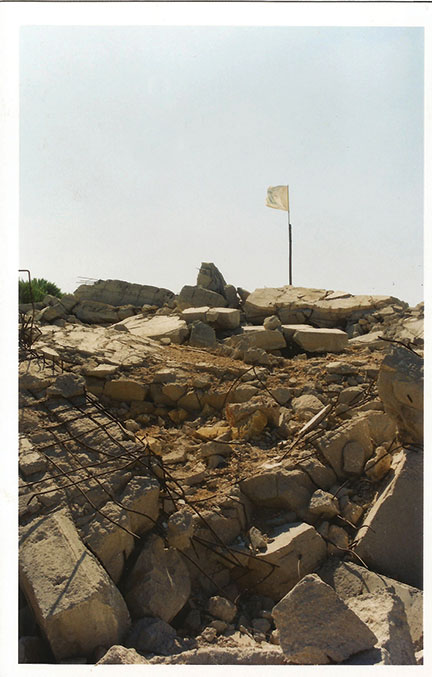 A Hezbollah flag flies over the remains of the Pumpkin fort in Southern Lebanon, 2002. (Courtesy of the author.) 