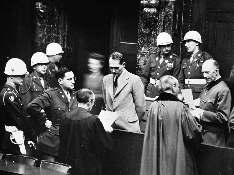 Captain Gustave Mark Gilbert, Nuremberg trials psychologist, observes Rudolf Hess, who had  claimed amnesia, 1945. (Photo by Roger Viollet/Getty Images.) 