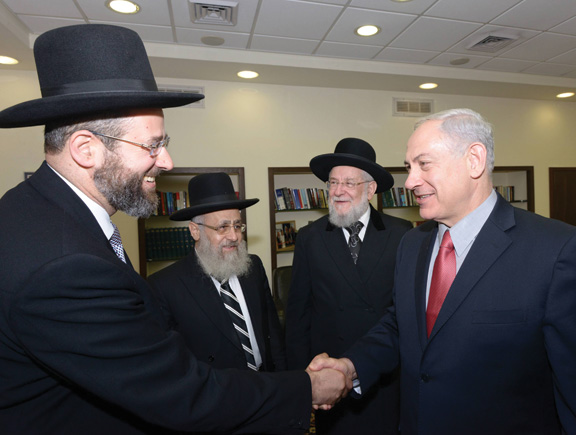Newly elected chief rabbis, David Lau and Yitzhak Yosef, with Rabbi Israel Meir Lau and Benjamin Netanyahu. (Photo by Amos Ben Gershom, courtesy of the Government Press Office, Israel.)