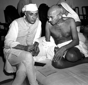 Jawaharlal Nehru with Gandhi during a meeting of the All India Congress.